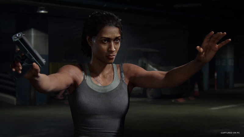 Marlene holds a pistol with her other hand raised in The Last of Us Part I