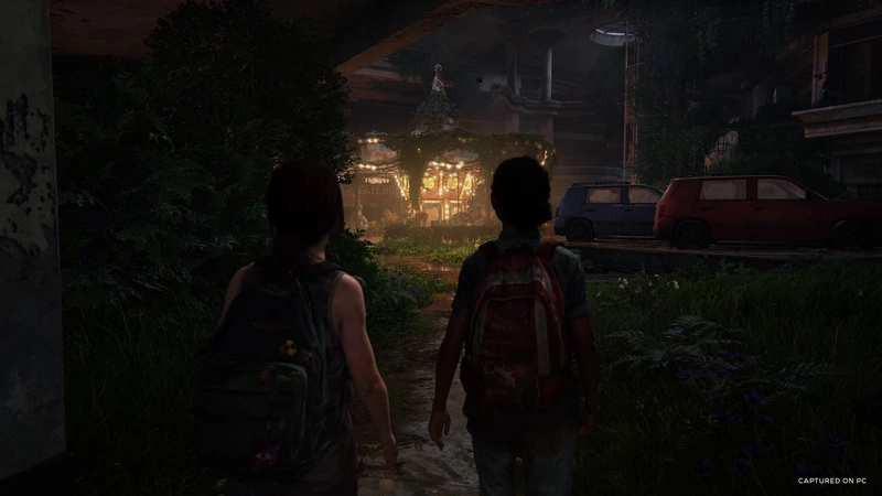 Characters explore an abandoned shopping mall in The Last of Us Part I
