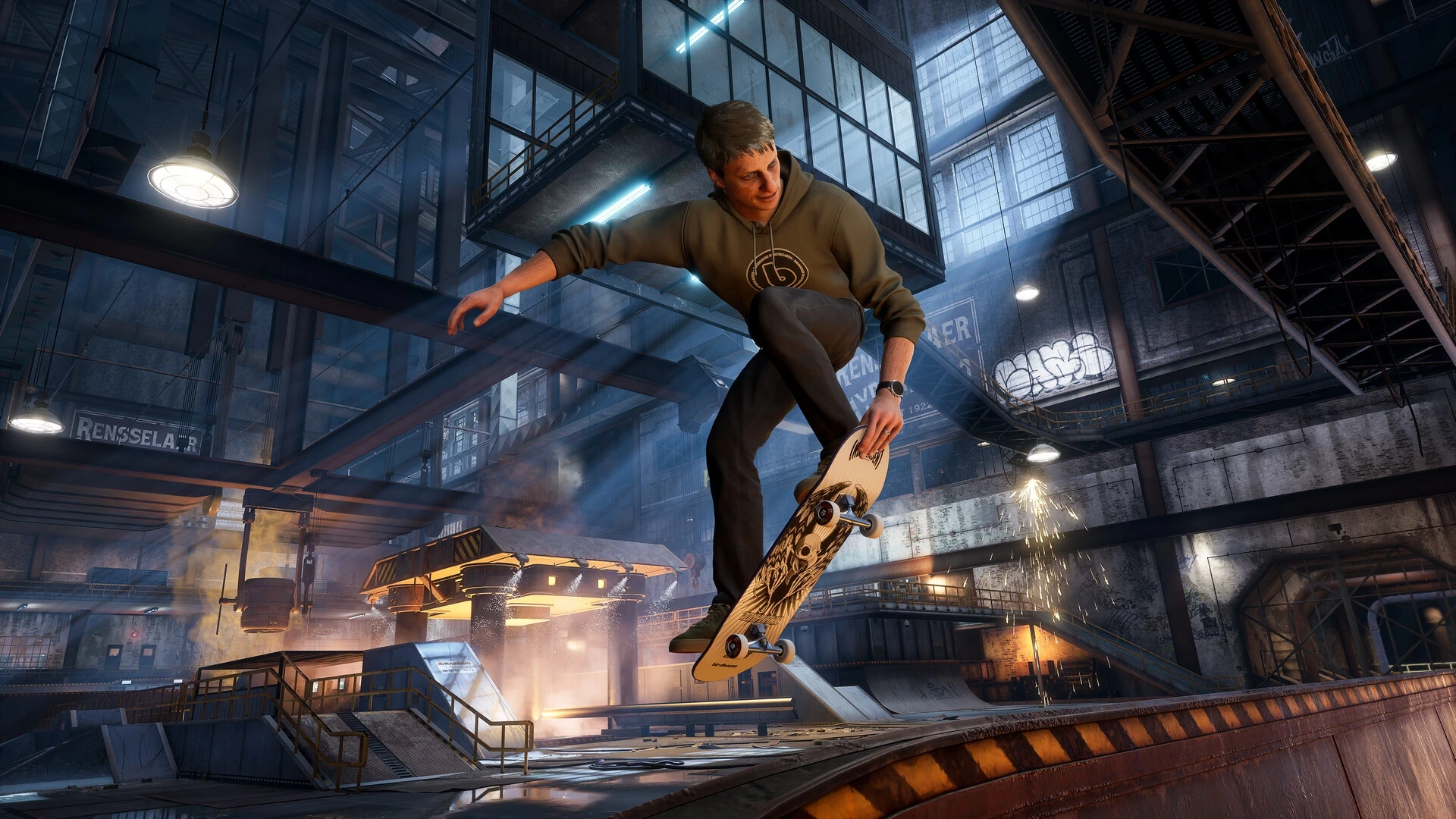 Ein Skater springt über eine Plattform in einer Fabrikhalle