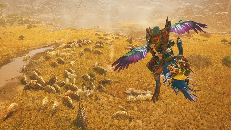 Monster Hunter Wilds: Охотник верхом над стадом монстров в золотистом поле