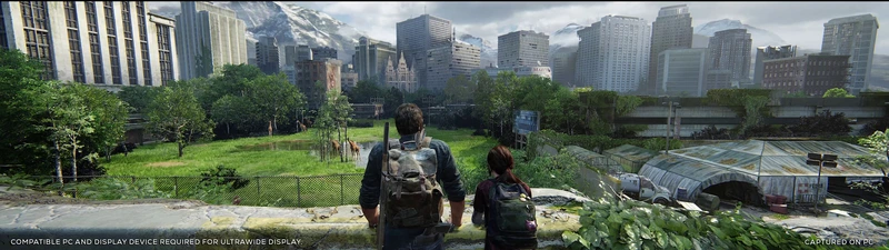 Joel and Ellie overlook a city in an ultrawide view of The Last of Us Part I
