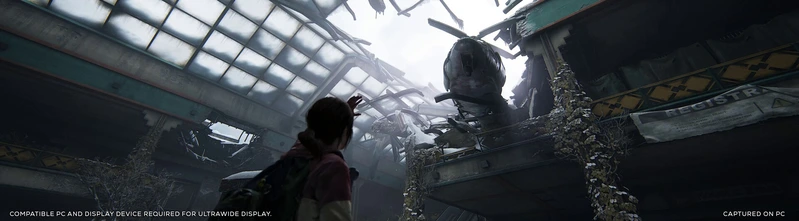 Ellie looks up at a helicopter in a collapsed roof in an ultrawide view of The Last of Us Part I