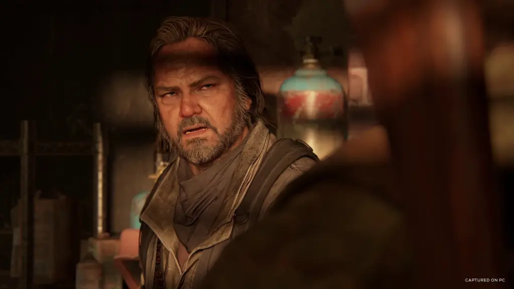 A close-up of Bill indoors in The Last of Us Part I