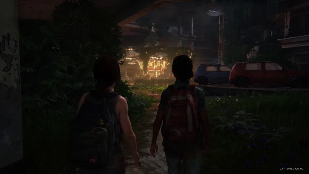 Characters explore an abandoned shopping mall in The Last of Us Part I