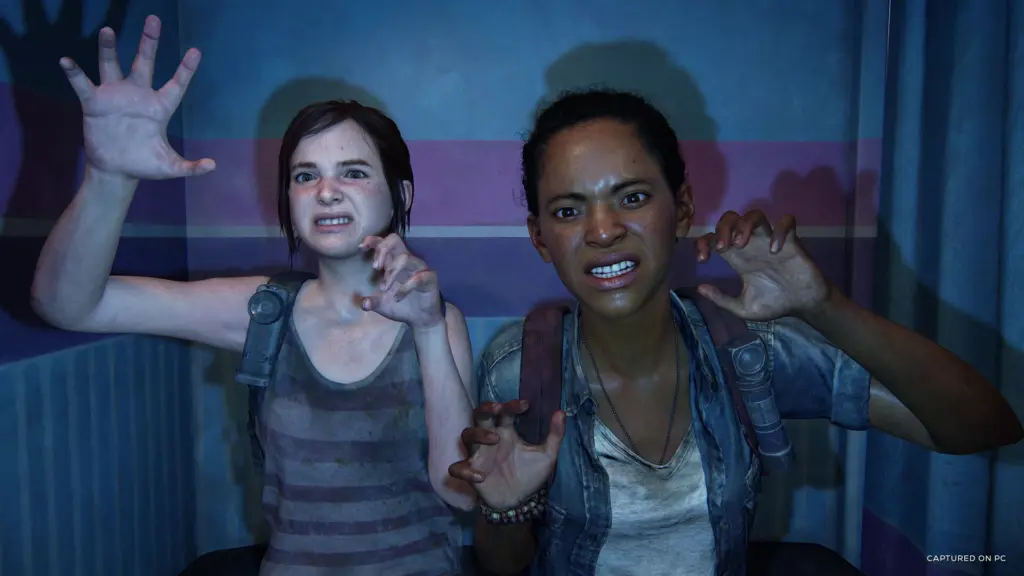 Ellie and Riley pose for a photograph in The Last of Us Part I
